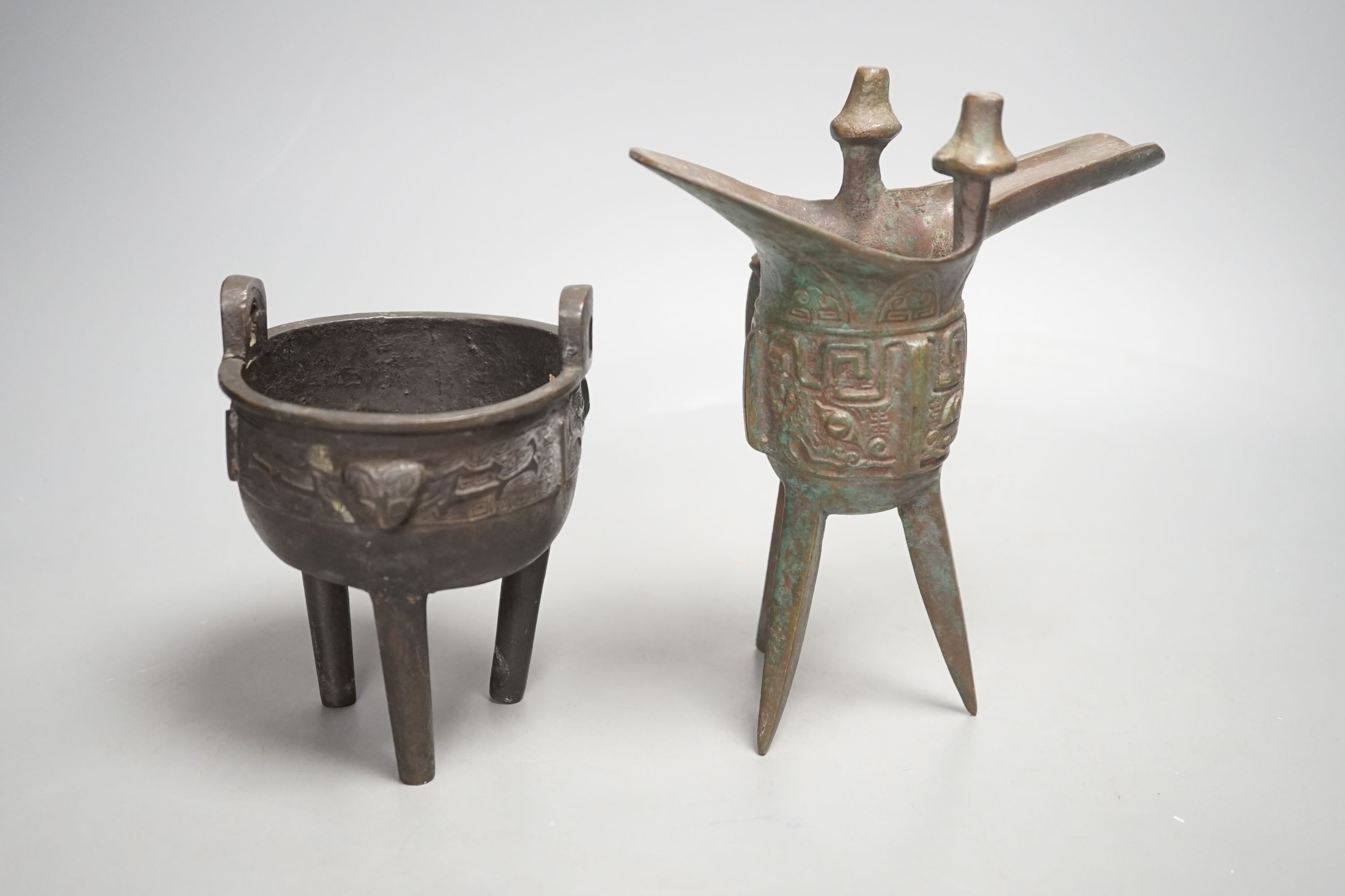 A Chinese bronze wine vessel and bronze tripod censer, wine vessel 19cms high